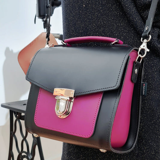 Handmade leather two tone sugarcube handbag in black and magenta by Zatchels